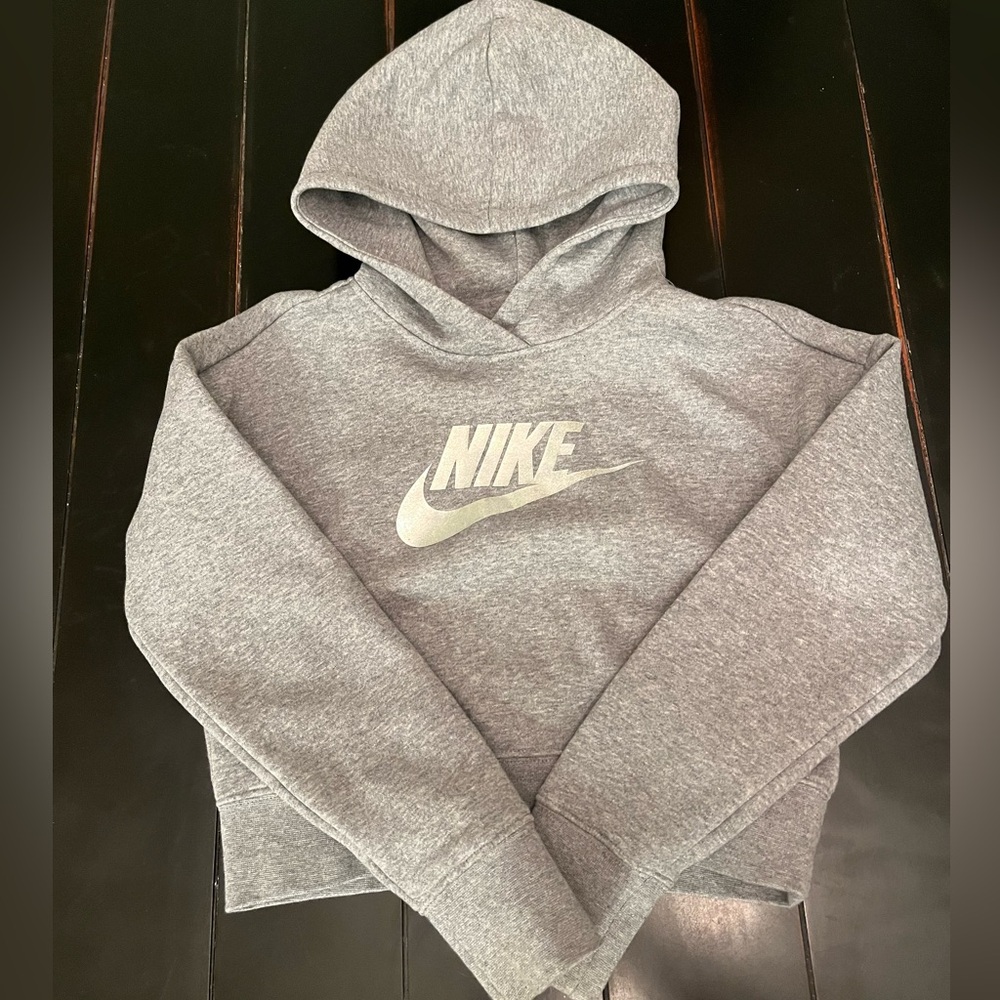 2 girls Nike and Champion sweatshirts. Size medium. Smoke free home.
